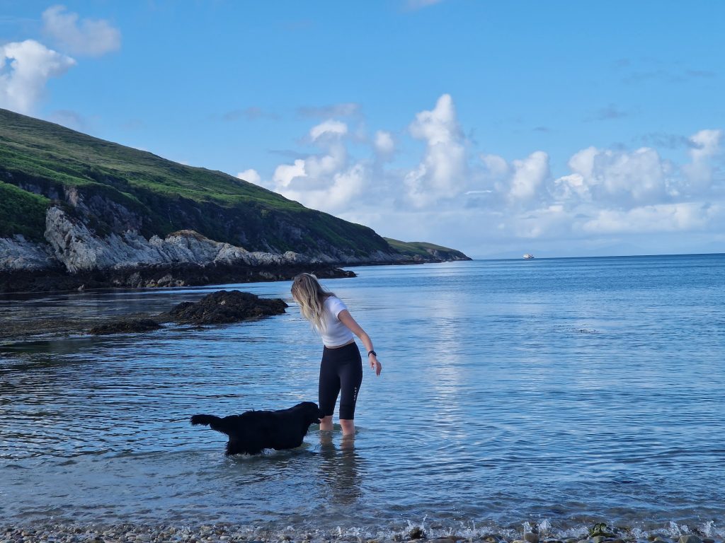 Girl and dog in the sea