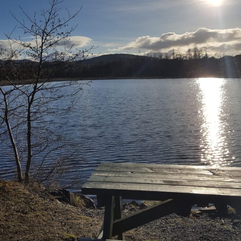 Loch with sun shine on it