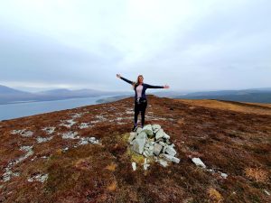 Girl on top of a mountain