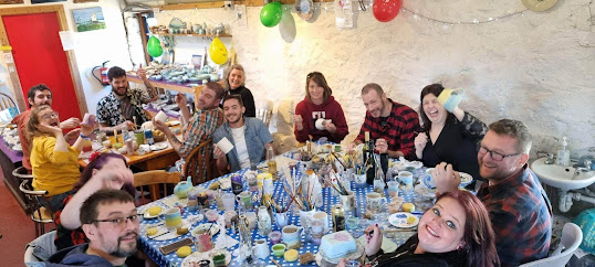 People painting pottery