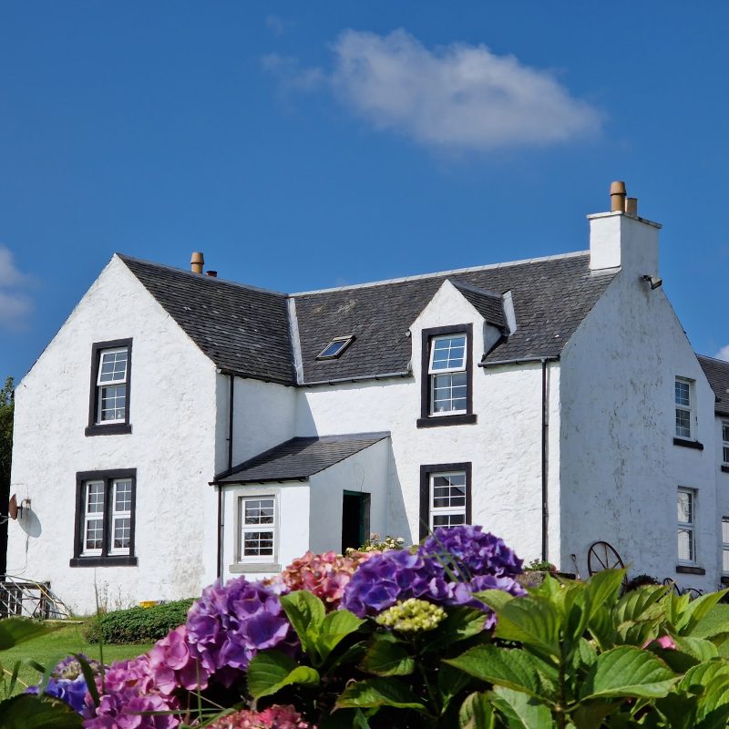 Farmhouse with flowers infront