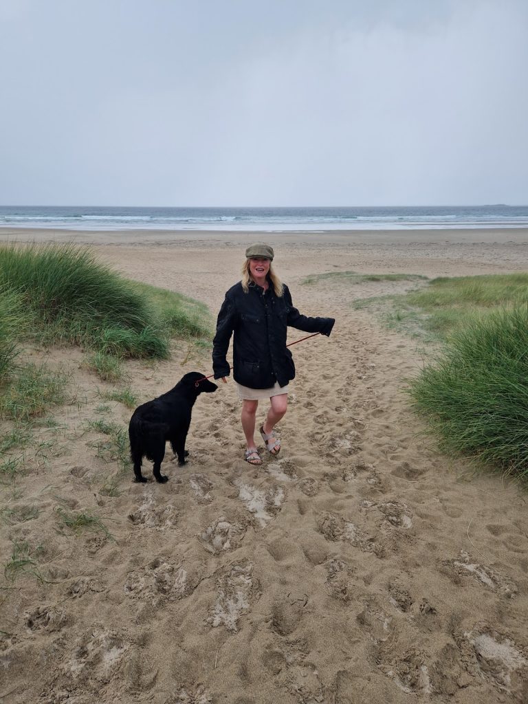 Woman and dog on beach