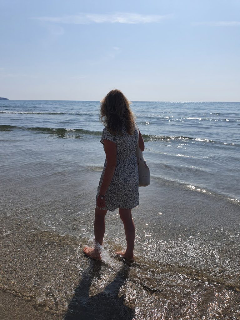 Woman paddling in the sea