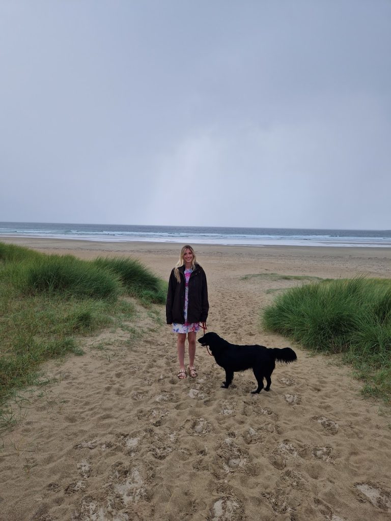 Woman and dog on beach