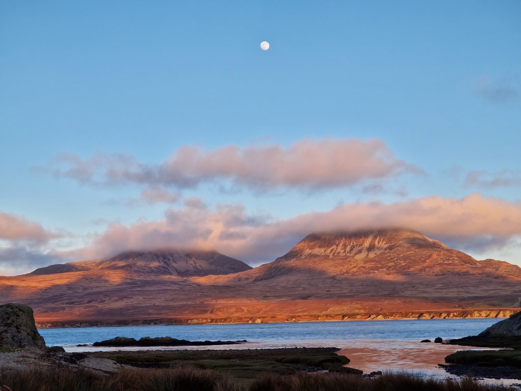 Hills, the sea and a full moon