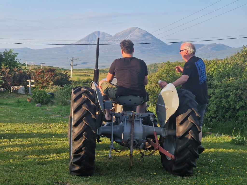 A man driving a vintage tractor