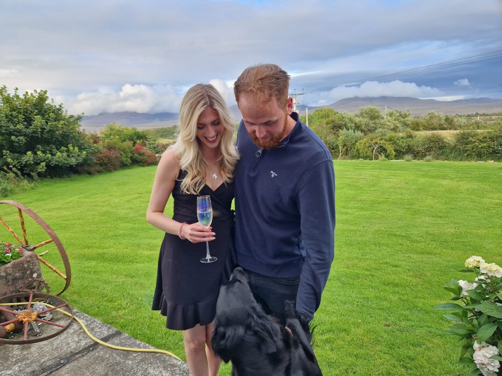 Couple stroking a dog